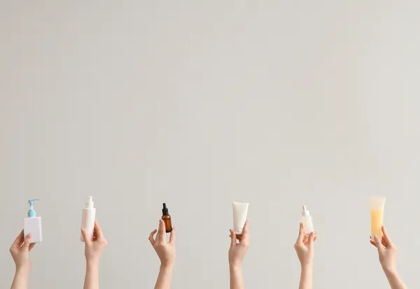 Hands holding beauty skincare products - influencer creator UGC content for brand marketing