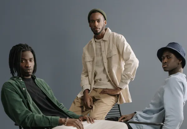 Three male creators in casual streetwear posing together for a professional influencer marketing campaign photo