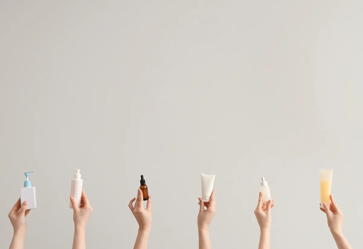 Hands holding beauty skincare products - influencer creator UGC content for brand marketing